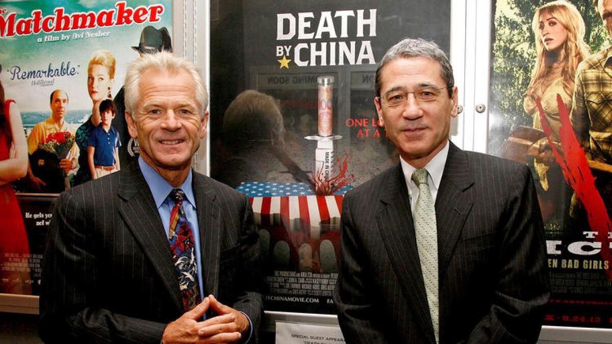 Peter Navarro, left, and China expert Gordon Chang attend a screening of "Death By China," the film adaptation of Navarro's book, in New York in 2012.
