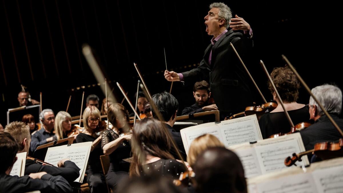 David Lockington conducts the Pasadena Symphony through Beethoven's Ninth Symphony at the Ambassador Auditorium on Saturday afternoon.