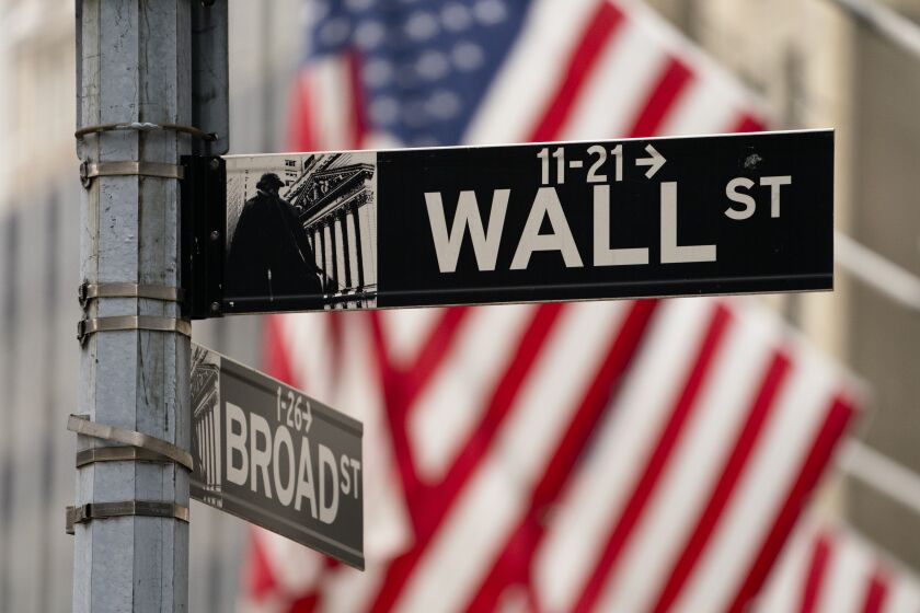 Street signs at the intersection of Wall and Broad Streets are shown in lower Manhattan, Wednesday, Oct. 13, 2021. Stocks are opening lower on Wall Street Monday, Oct. 18, 2021, as the market's momentum slows following its best week since July. (AP Photo/John Minchillo, File)