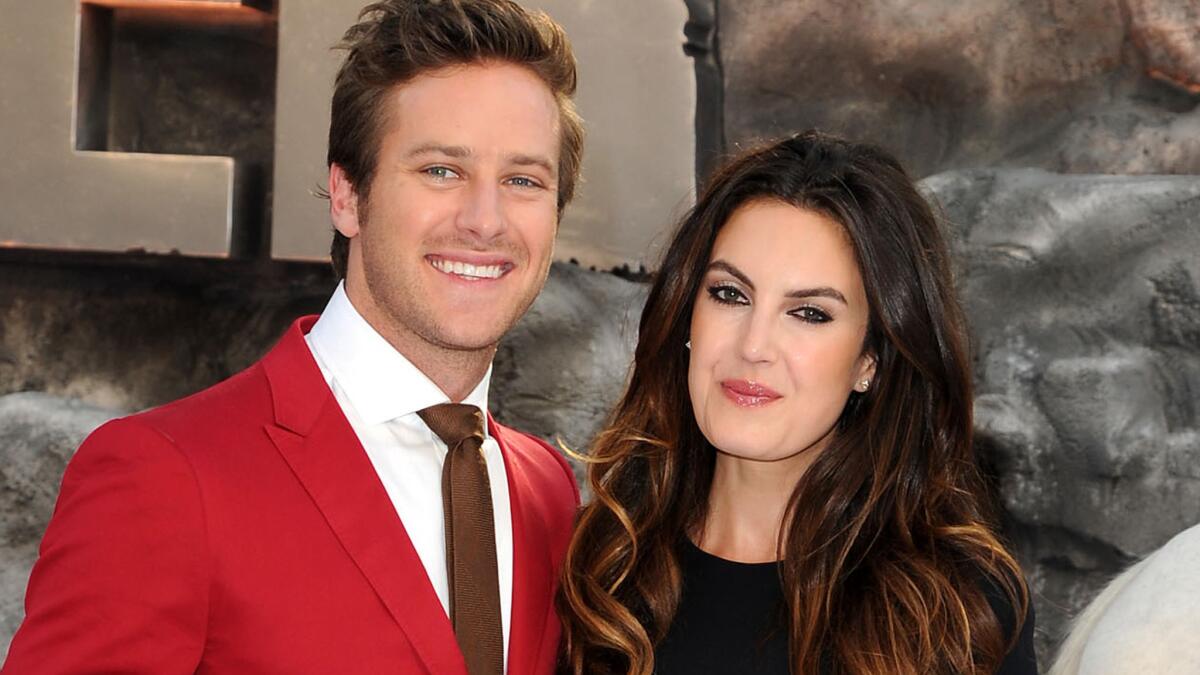 Armie Hammer and his wife, Elizabeth Chambers, shown at the London premiere of "The Lone Ranger" in July 2013, welcomed a baby daughter on Monday.