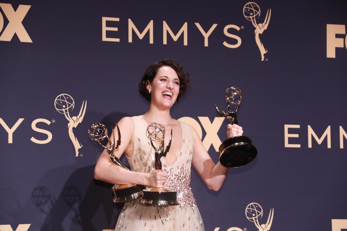 Phoebe Waller-Bridge holding her three Emmys for 'Fleabag'