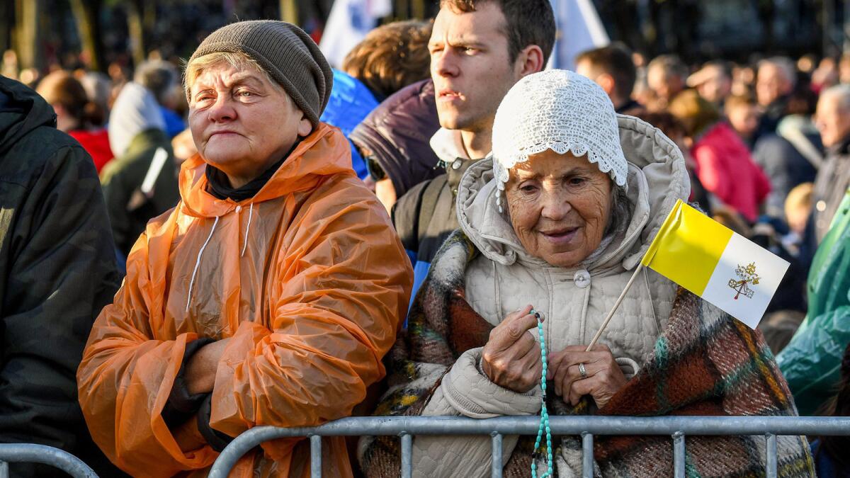 The faithful attend Mass in Santakos Park in Kaunas, Lithuania.