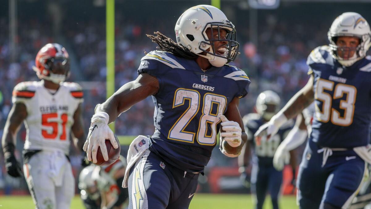 Chargers running back Melvin Gordon smiles as he runs into the endzone for an 11-yard touchdown against the Browns.