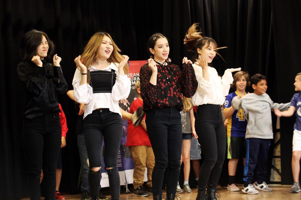 The Minnesota K-Pop Dance Crew perform for the dual-immersion Korean-language students at Monte Vista Elementary School in La Crescenta on Friday. K-Pop dance is a mix of hip-hop and Korean pop music and MKDC is the most popular K-Pop performance team in the Midwest.