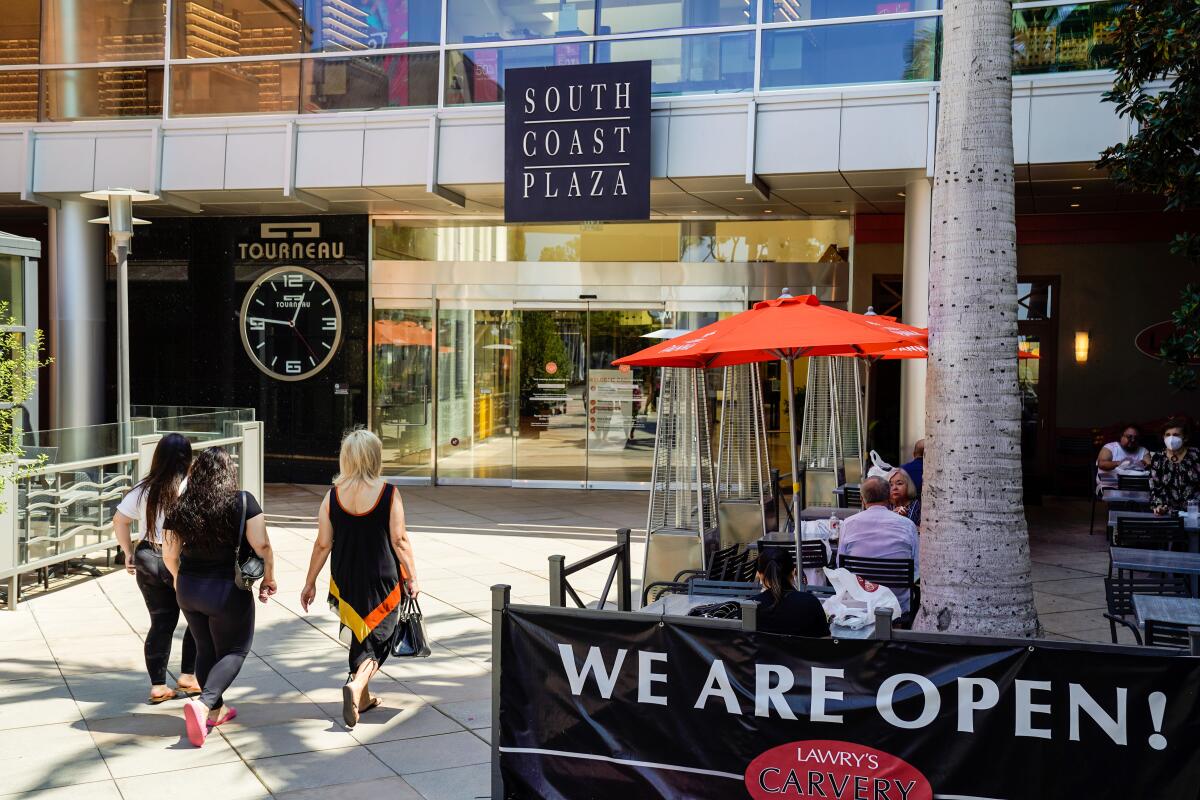 Shoppers enter South Coast Plaza in Costa Mesa in August 2020.  