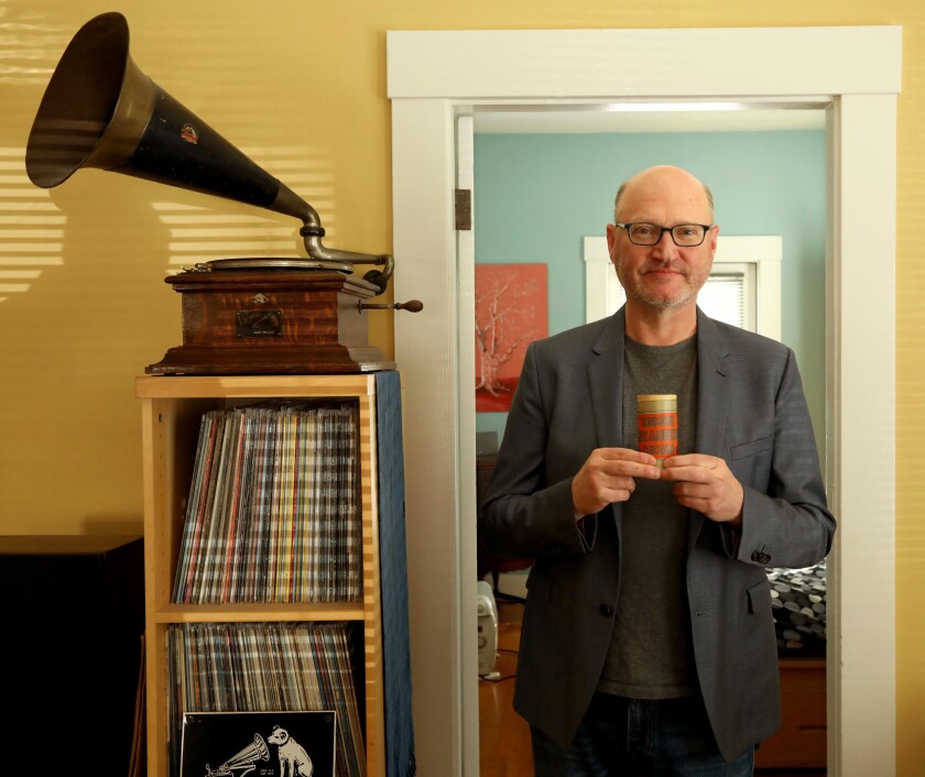 David Seubert holds an Edison Blue Amberol cylinder record