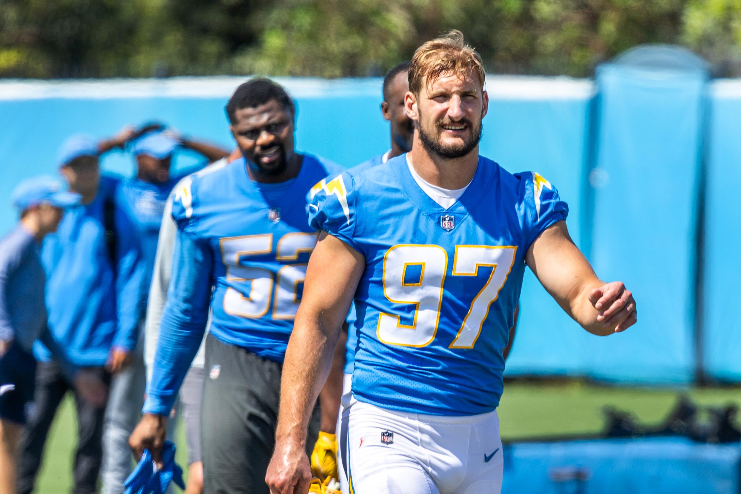 Chargers outside linebackers Khalil Mack, left, and Joey Bosa walk off the field during practice.