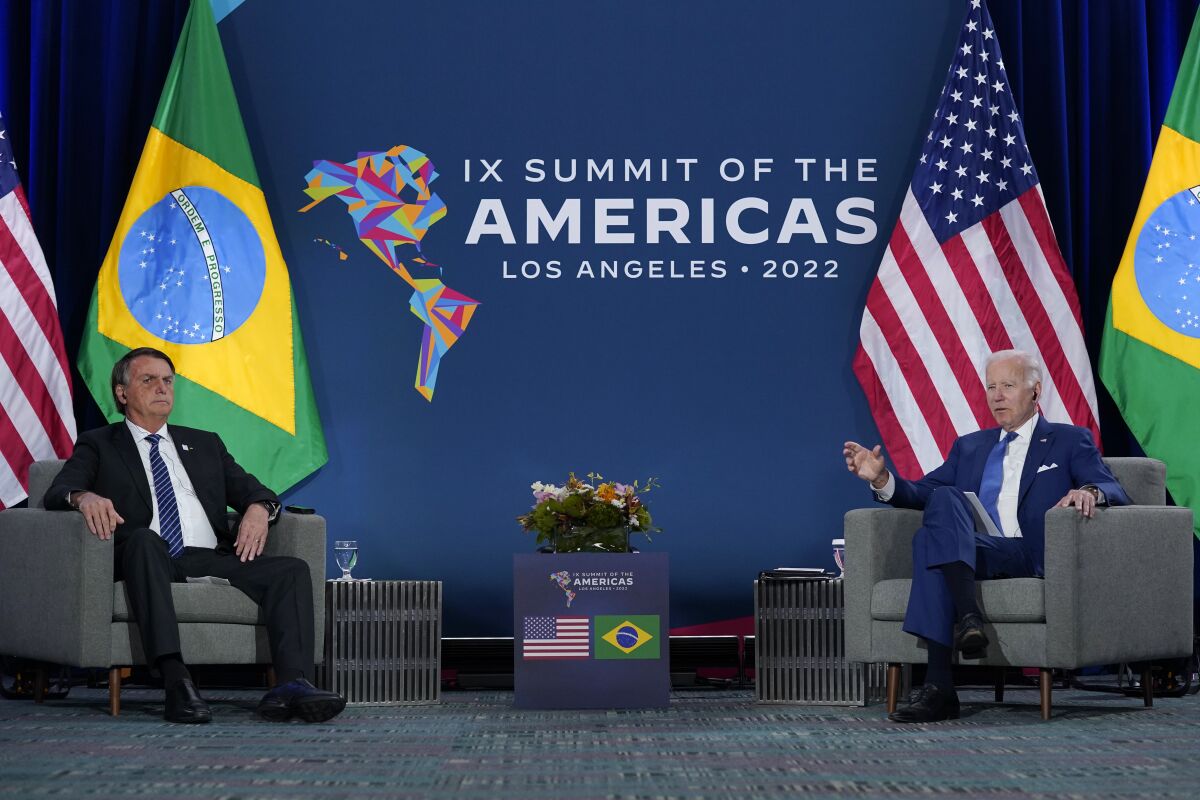 President Joe Biden, right, meets with Brazilian President Jair Bolsonaro during the Summit of the Americas, Thursday, June 9, 2022, in Los Angeles. (AP Photo/Evan Vucci)