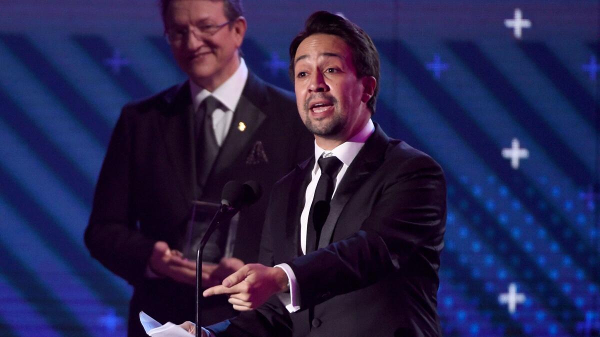 Lin-Manuel Miranda accepts the Latin Recording Academy President's Merit Award at the Latin Grammy Awards.