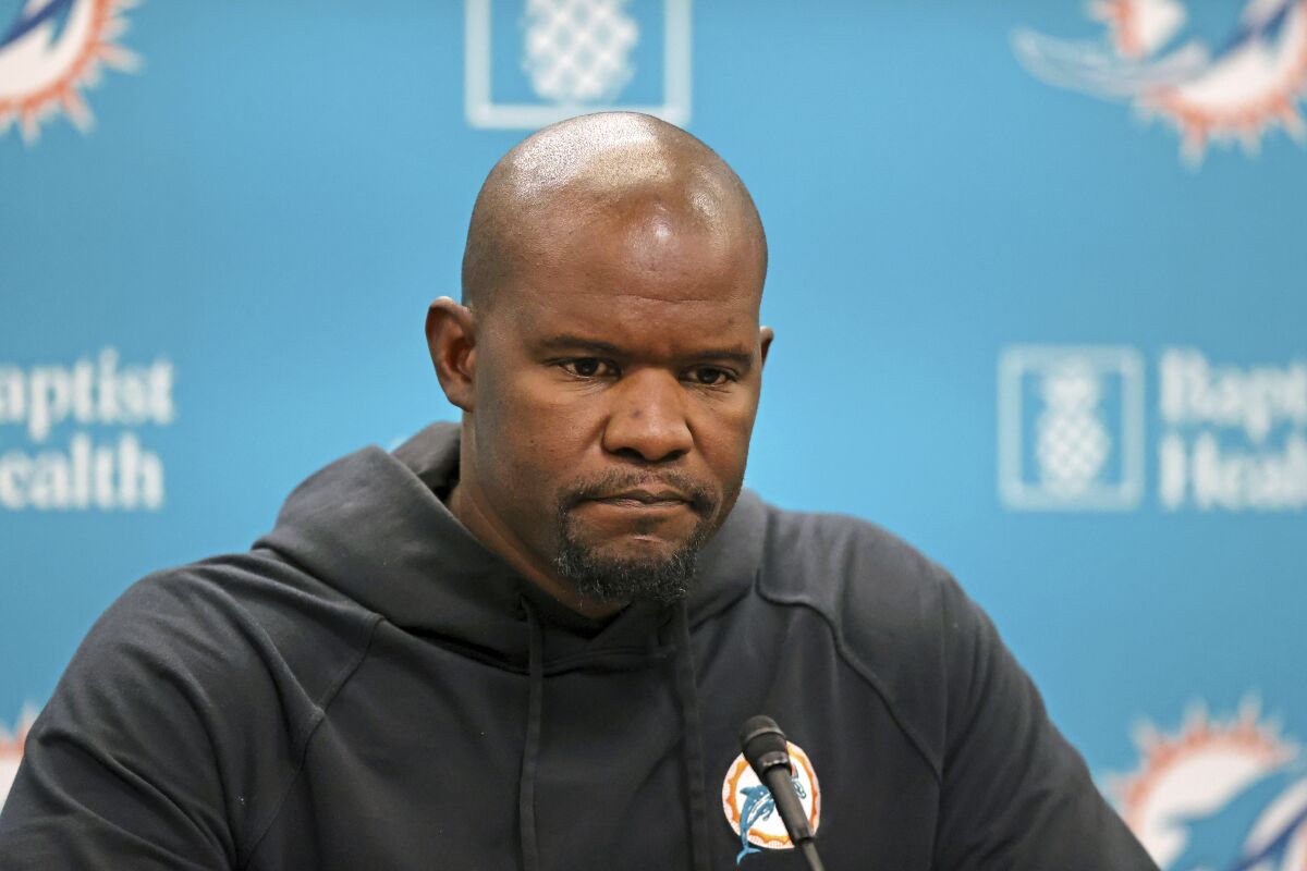 FILE - Miami Dolphins head coach Brian Flores talks to the media before an NFL football practice at Baptist Health Training Complex in Hard Rock Stadium in Miami Gardens, Fla., Wednesday, Oct. 6, 2021. Former Miami Dolphins coach Brian Flores filed a class-action lawsuit against the NFL alleging racist hiring practices. (David Santiago/Miami Herald via AP, File)