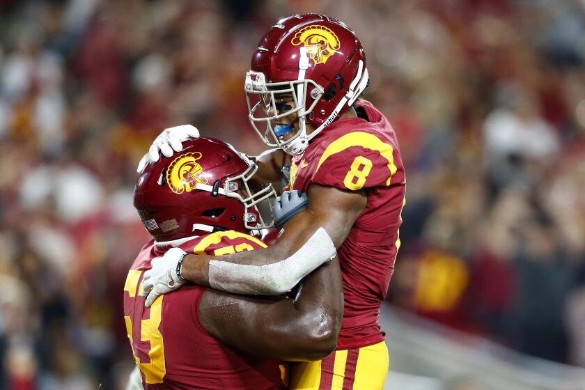 LOS ANGELES, CALIF. - SEP. 7, 2019. USC wide receiver Amon-Ra St. Brown is congratulated b y teammate Drew Richmond after scoring a touchdwon against Stanford in the second quarter at the L.A. Memorial Coliseum on Saturday night, Sep. 7, 2019. (Luis Sinco/Los Angeles Times)