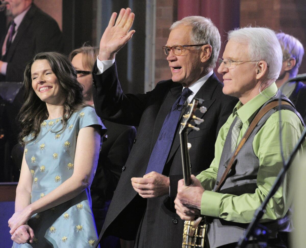 Singer/songwriter Edie Brickell, left, and comedian/musician Steve Martin join host David Letterman after performing a song from their recently released album, "Love Has Come for You."