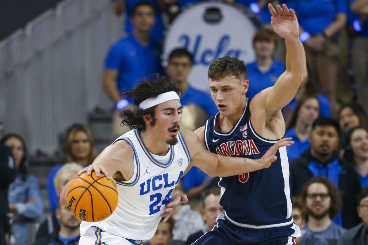 UCLA's Jaime Jaquez Jr. drives against Arizona's Pelle Larsson on March 4, 2023.