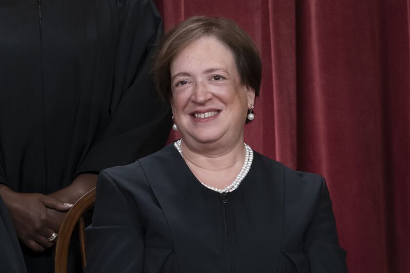 FILE - Associate Justice Elena Kagan joins other members of the Supreme Court as they pose for a new group portrait, at the Supreme Court building in Washington, Oct. 7, 2022. Supreme Court justices tend to wipe the slate clean at the start of a new term, the bruised feelings occasioned by tough cases eased by a summer break. But this year, some justices are engaging in an extended and unusual public disagreement over the court's legitimacy that stems from the decision to overturn Roe v. Wade. (AP Photo/J. Scott Applewhite, File)