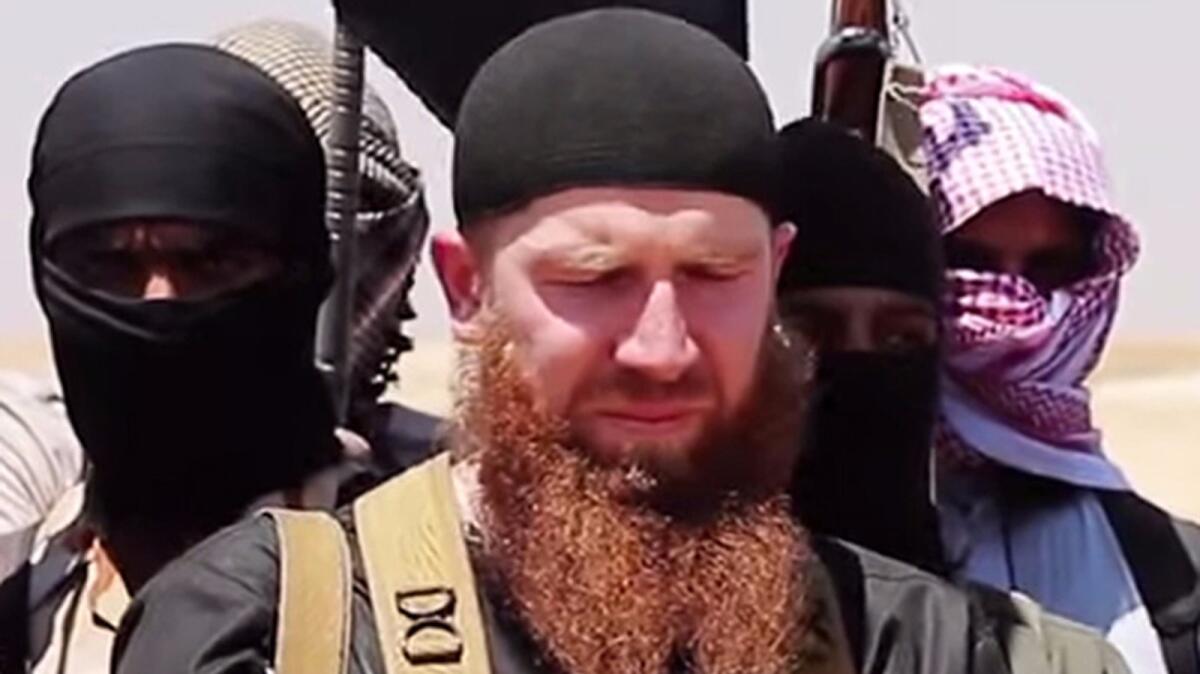 This file photo shows an image made available by Jihadist media outlet al-Itisam Media, allegedly showing members of the Islamic State group including military leader and Georgian native, Abu Omar al-Shishani (center).