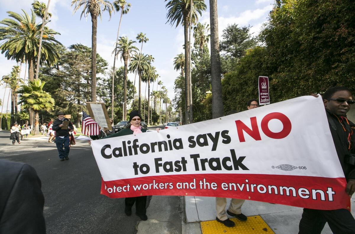 Protesters take to the streets of Beverly Hills on May 7 to oppose "fast tracking" the Trans-Pacific Partnership.