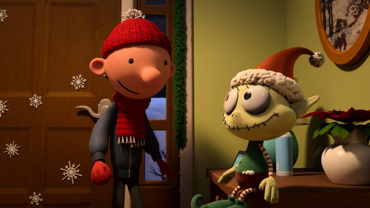 Greg (voiced by Wesley Kimmel) and Elfrendo in "Diary of a Wimpy Kid Christmas: Cabin Fever," now streaming on Disney+.