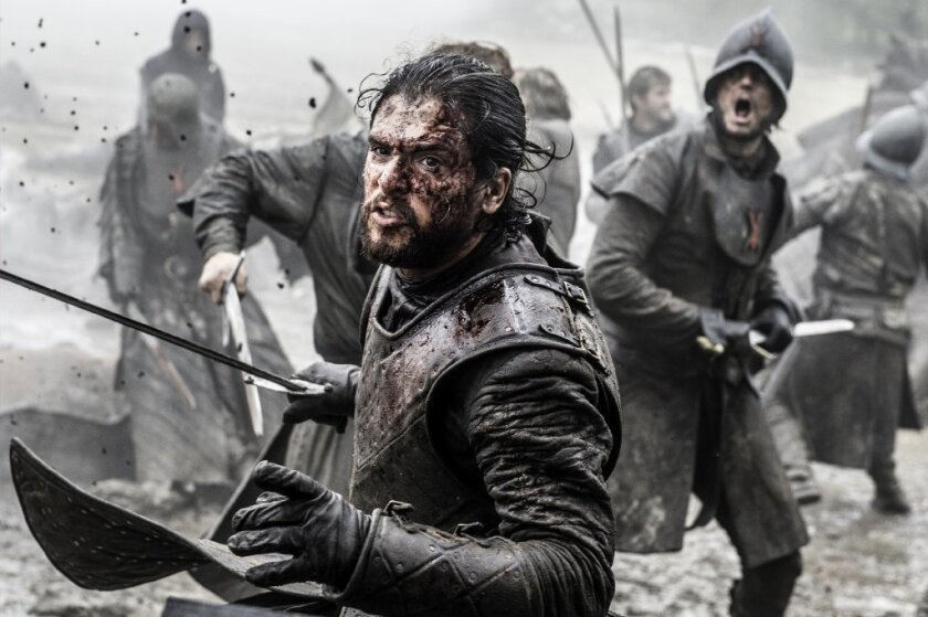 This file image released by HBO shows Kit Harington in a scene from "Game of Thrones." Even in a world with magic, dragons and deadly supernatural White Walkers, HBO's popular show has plenty of economic lessons to teach.