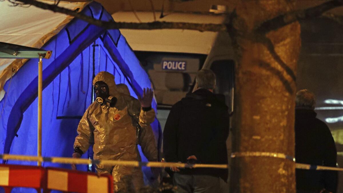 Investigators set up a police tent on March 6, 2018, in Salisbury, England, near where former Russian spy Sergei Skripal was found critically ill.