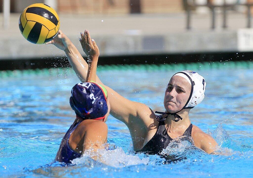 Newport Water Polo Foundation's Rachel Whitelegge, right, shoots for the net defended by United Water Polo Club's Marylynn Cuozzo during the first half in a USA Water Polo Junior Olympics match at Capistrano Valley High in Mission Viejo on Thursday.
