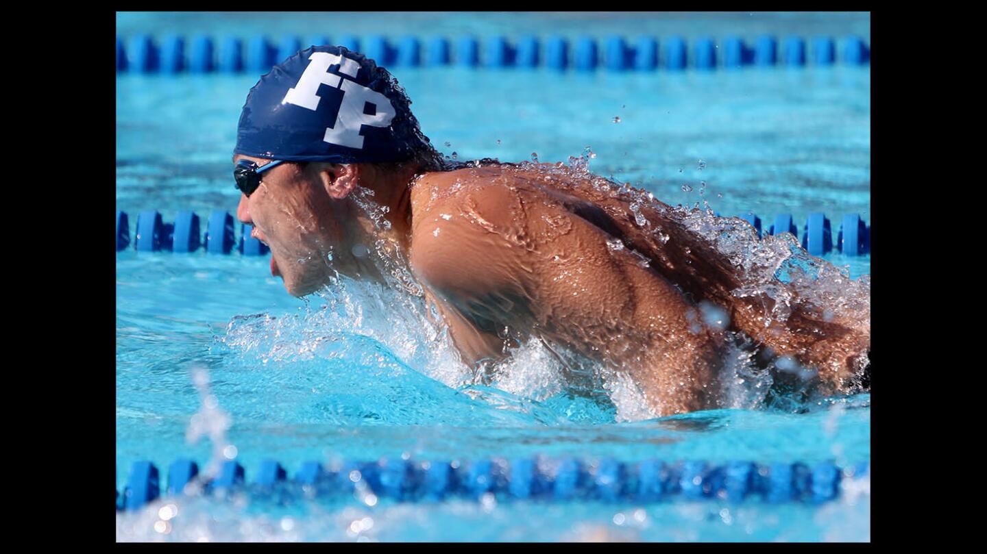 Flintridge Prep swimmer Winston Chen came in second place in the boys varsity 100-yard butterfly event vs. Polytechnic School at Poly in Pasadena on Tuesday, April 10, 2018.
