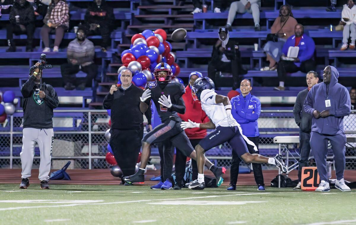 CJ McBean of Gardena Serra High has a step on a defender as he attempts to catch a deep pass down the sidline.