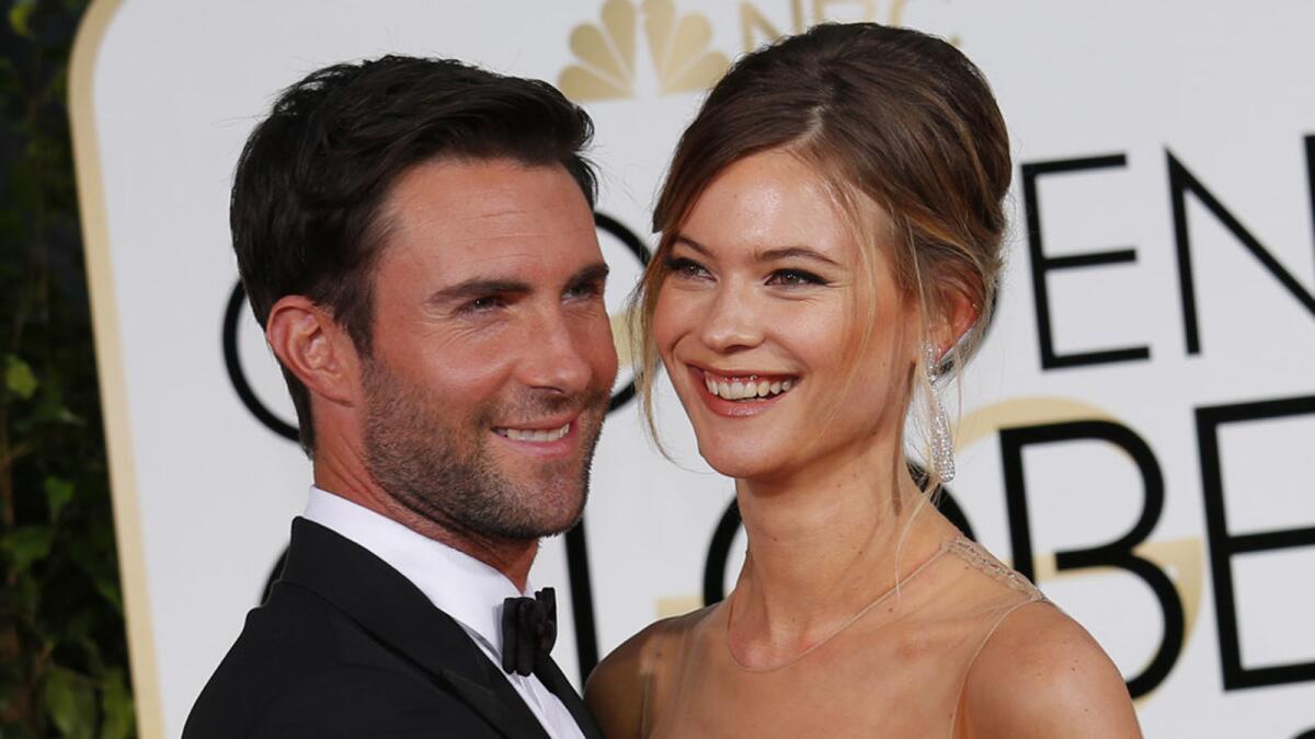 Adam Levine and Behati Prinsloo at the Golden Globes in January 2015.