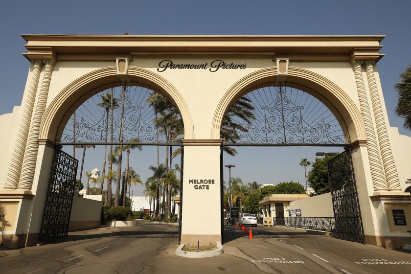 The double-arch entryway to Paramount Pictures with palm trees visible in the background