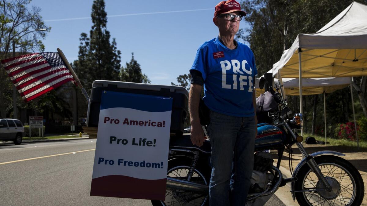 Sean Colgan has been counter-protesting since the rallies outside Rep. Darrell Issa's district offices started last February.
