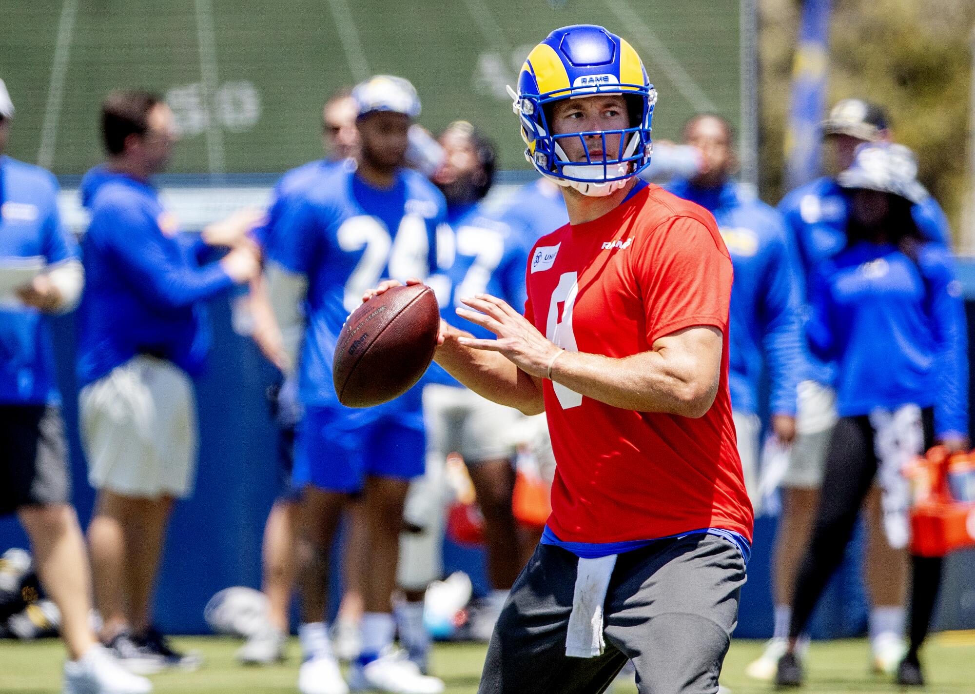  Rams quarterback Matthew Stafford looks to pass during training camp.