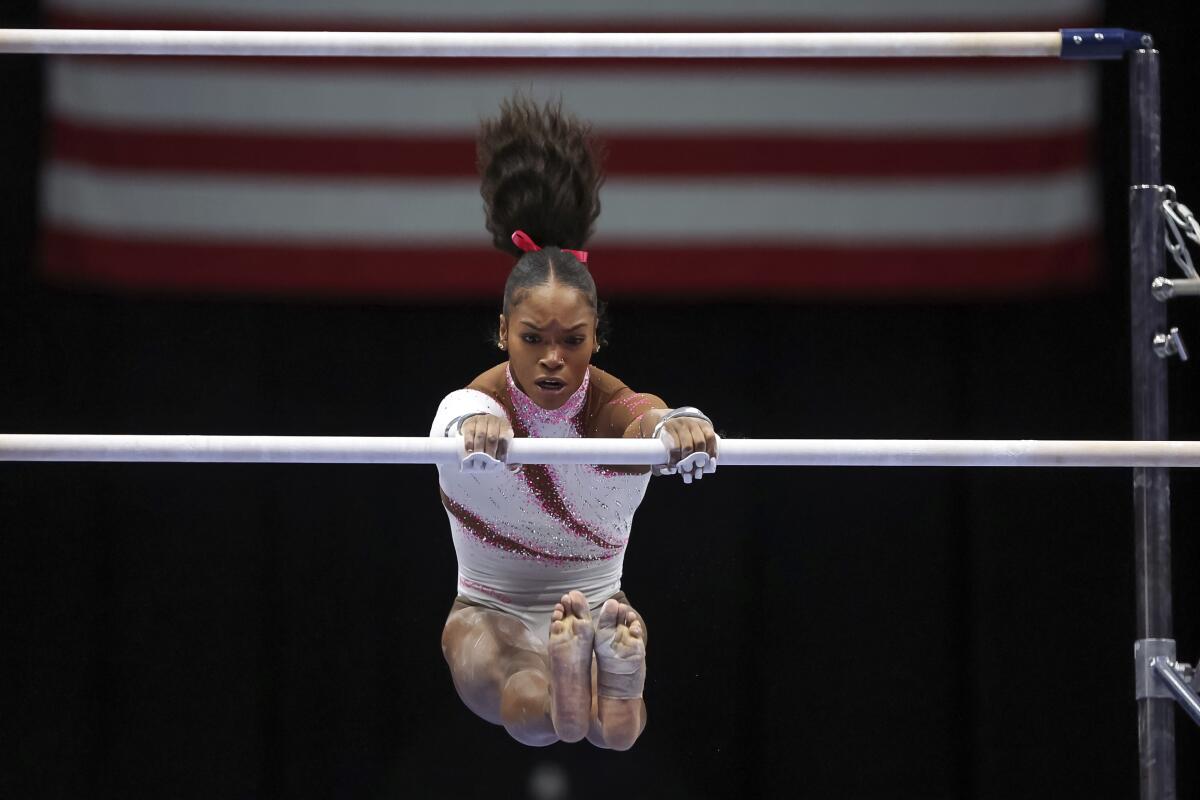 Shilese Jones competes on the uneven bars during the U.S. gymnastics championships Friday.