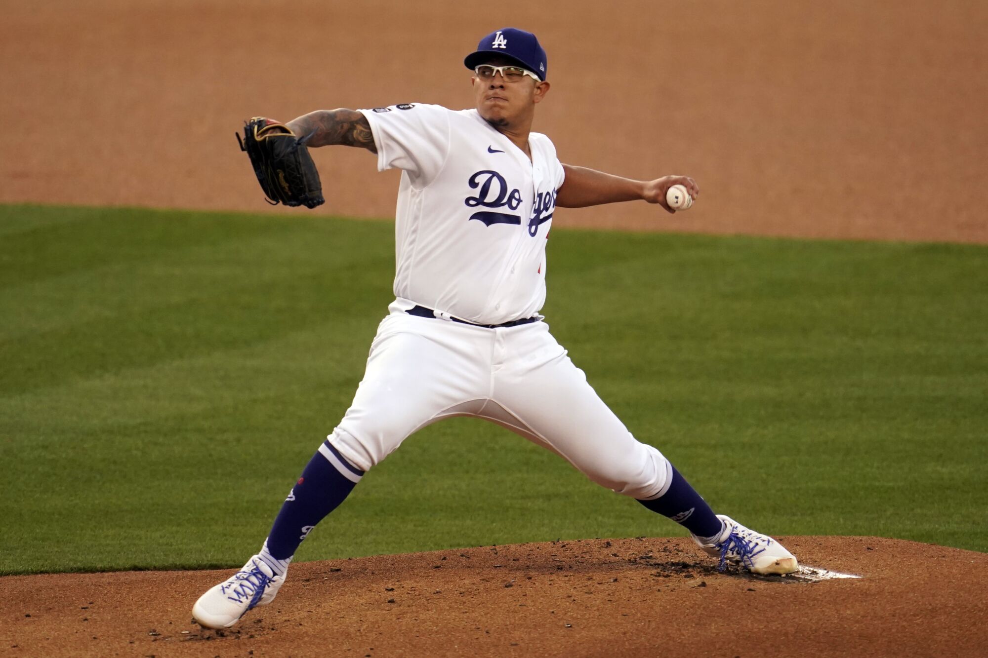 Los Angeles Dodgers starting pitcher Julio Urias throws to a Seattle Mariners batter during the first inning.