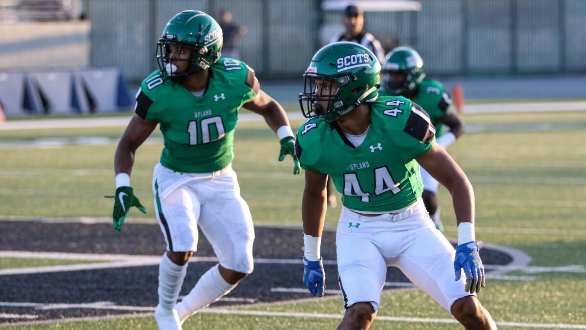 Justin Flowe (No. 10) and Jonathan Flowe (No. 44) await a snap against La Habra on Aug. 22.