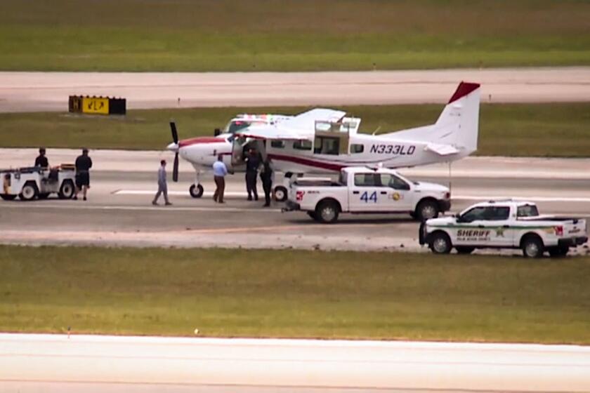 PALM BEACH COUNTY, FL. - A passenger on a private plane landed safely at Palm Beach International Airport on Tuesday after the pilot became incapacitated. (WPTV-TV/AP)