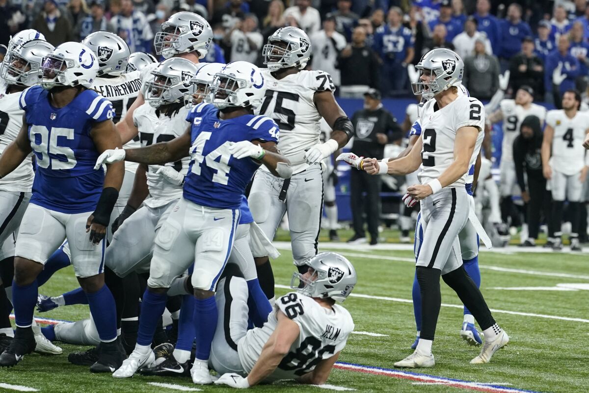 Las Vegas Raiders kicker Daniel Carlson (2) celebrates after kicking a 33-yard field goal on the final play of an NFL football game against the Indianapolis Colts, Sunday, Jan. 2, 2022, in Indianapolis. The Raiders won 23-20. (AP Photo/Darron Cummings)
