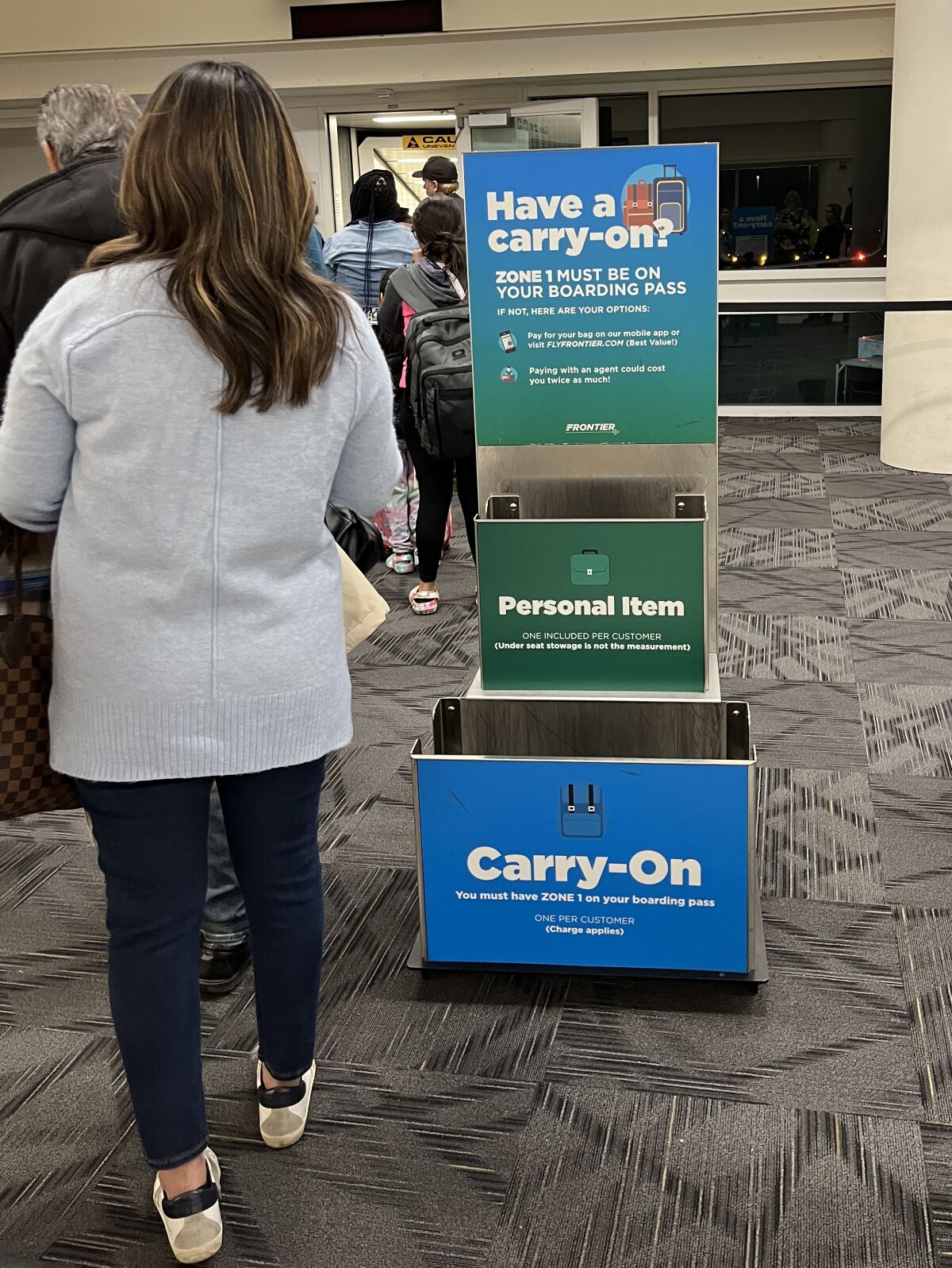 A box to see if your carry-on bag meets the size requirements. 