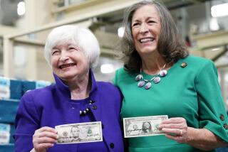 Secretary of the Treasury Janet Yellen, left, and Treasurer of the United States Chief Lynn Malerba show of money they autographed during a tour of the Bureau of Engraving and Printing's (BEP) Western Currency Facility in Fort Worth, Texas, Thursday, Dec. 8, 2022. Yellen unveiled the first U.S. currency bearing her signature, marking the first time that U.S. bank notes will bear the name of a female treasury secretary. (AP Photo/LM Otero)