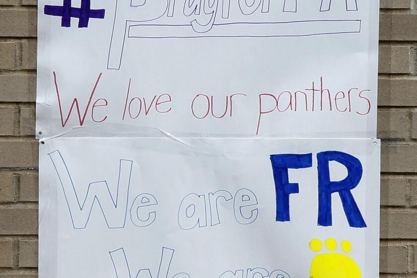 A student-made sign shows school spirit at Franklin Regional High School the day after a stabbing attack Wednesday.