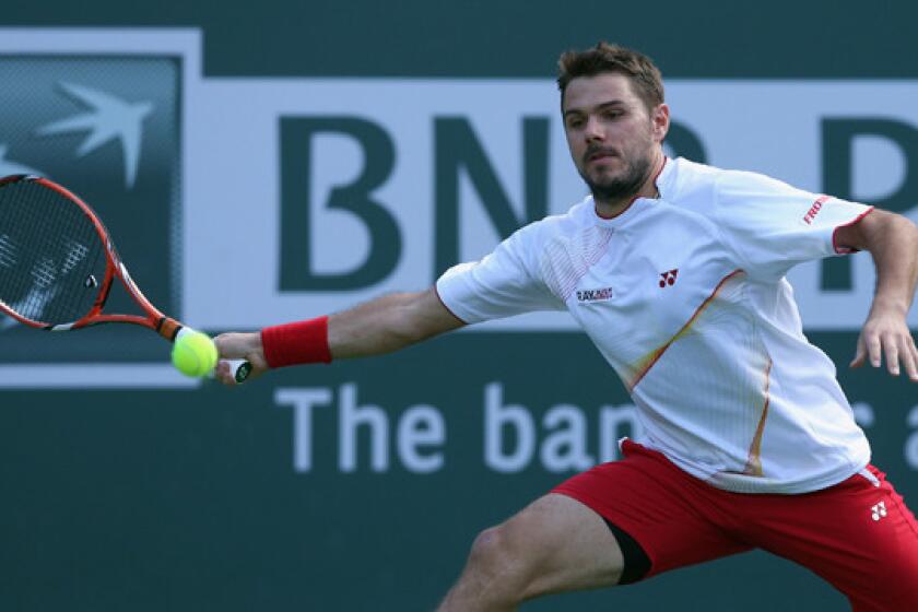 Stanislas Wawrinka lunges to return a shot during his win over Andreas Seppi at the BNP Paribas Open at Indian Wells on Monday.
