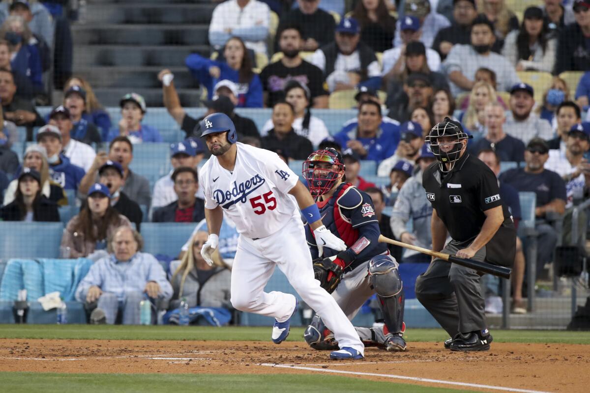 Albert Pujols tosses his bat after hitting a single during the second inning of the NLCS Game 5.