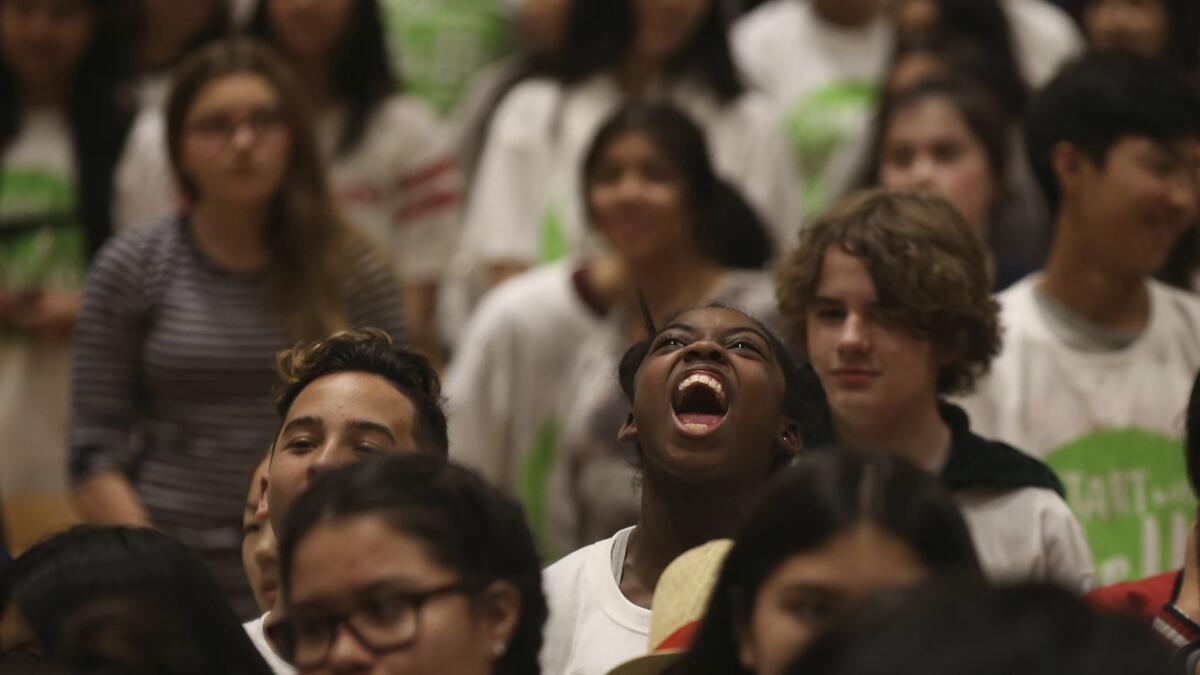 Alijah Haggins, 13, yells "hello" during a school violence prevention program at Eagle Rock Junior/Senior High School on Thursday.