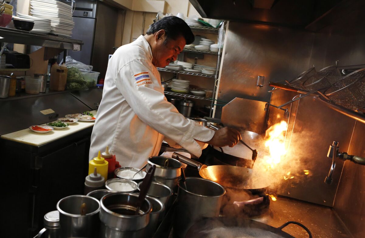 Chef Tui Sungkamee prepares a jungle curry at Jitlada.