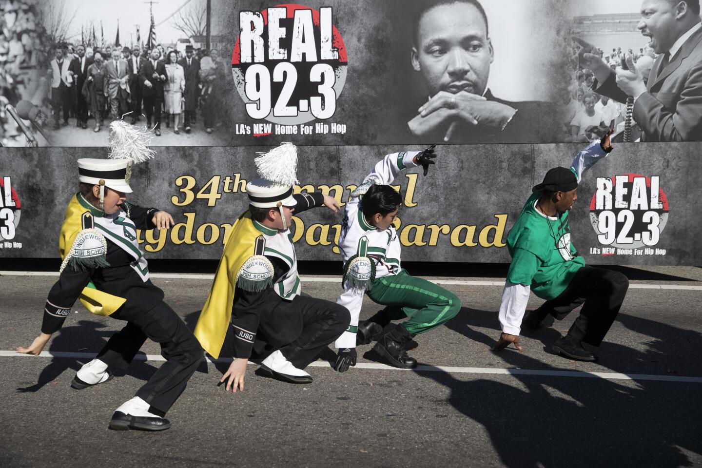 Inglewood High School Marching Band members dance to music before performing in honor of the legacy of Dr. Martin Luther King Jr. at the 34th annual Kingdom Day Parade along Martin Luther King Jr. Boulevard on Monday in Los Angeles. The theme was "Healthy Bodies, Healthy Minds, Healthy Democracy."