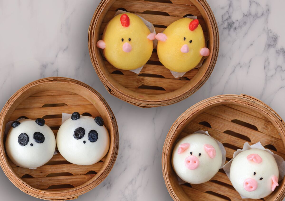 Harumama's crazy-cute character steamed buns (clockwise from top, chicken, caramelized onion and mozzarella; pork and caramelized onion; purple potato panda) are Instagram ideal. 