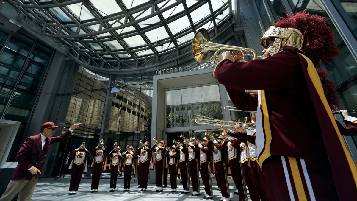 The USC marching band performs under the skylight during the grand opening ceremony for the Wilshire Grand Center in downtown Los Angeles.