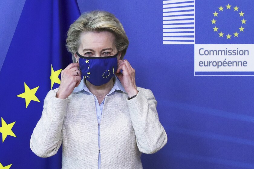 European Commission President Ursula von der Leyen removes her protective face mask prior to meeting with Jordan's King Abdullah II at EU headquarters in Brussels, Wednesday, May 5, 2021. (Yves Herman, Pool via AP)
