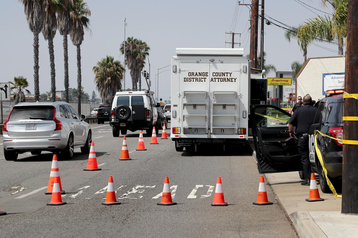  Traffic crawls along Newport Boulevard Wednesday morning as investigators collect evidence of a shooting in Costa Mesa.