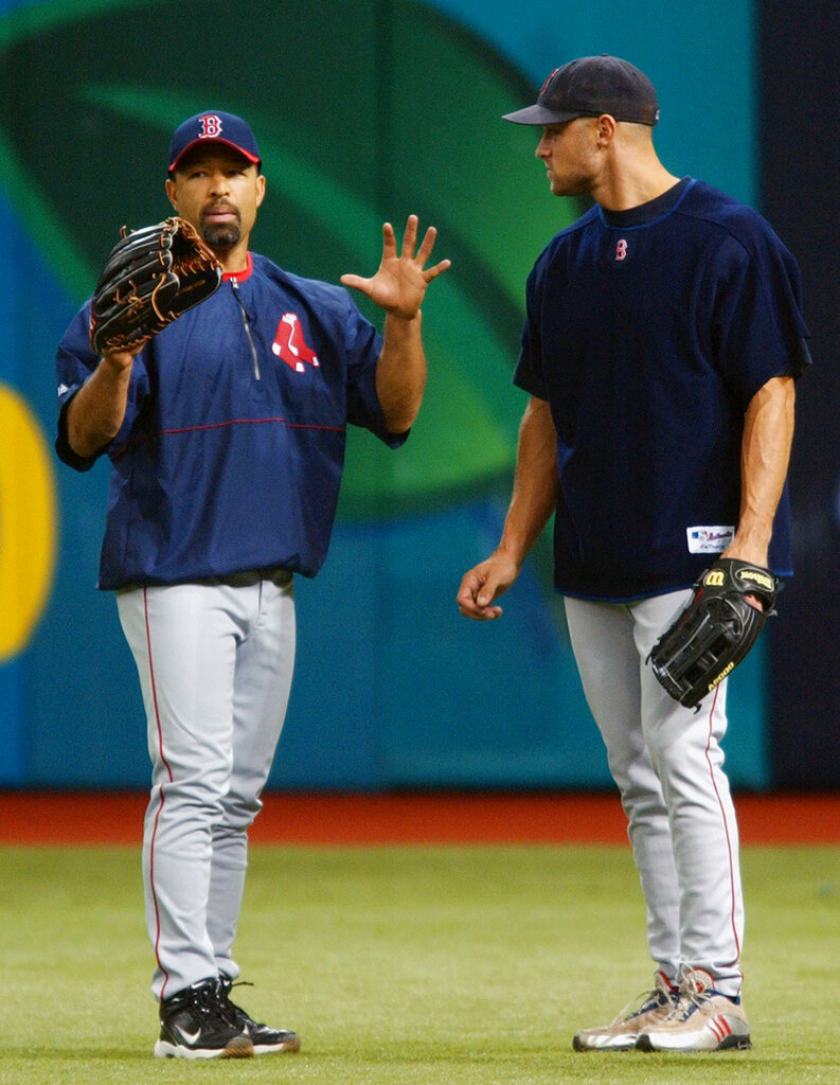 Boston Red Sox right fielder Dave Roberts talks to Gabe Kapler.