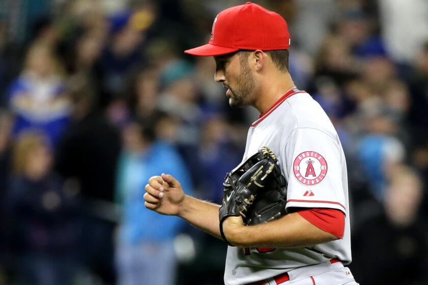 Angels closer Huston Street pumps his fist after recording the final out in a 5-3 win over the Mariners on April 8 in Seattle.