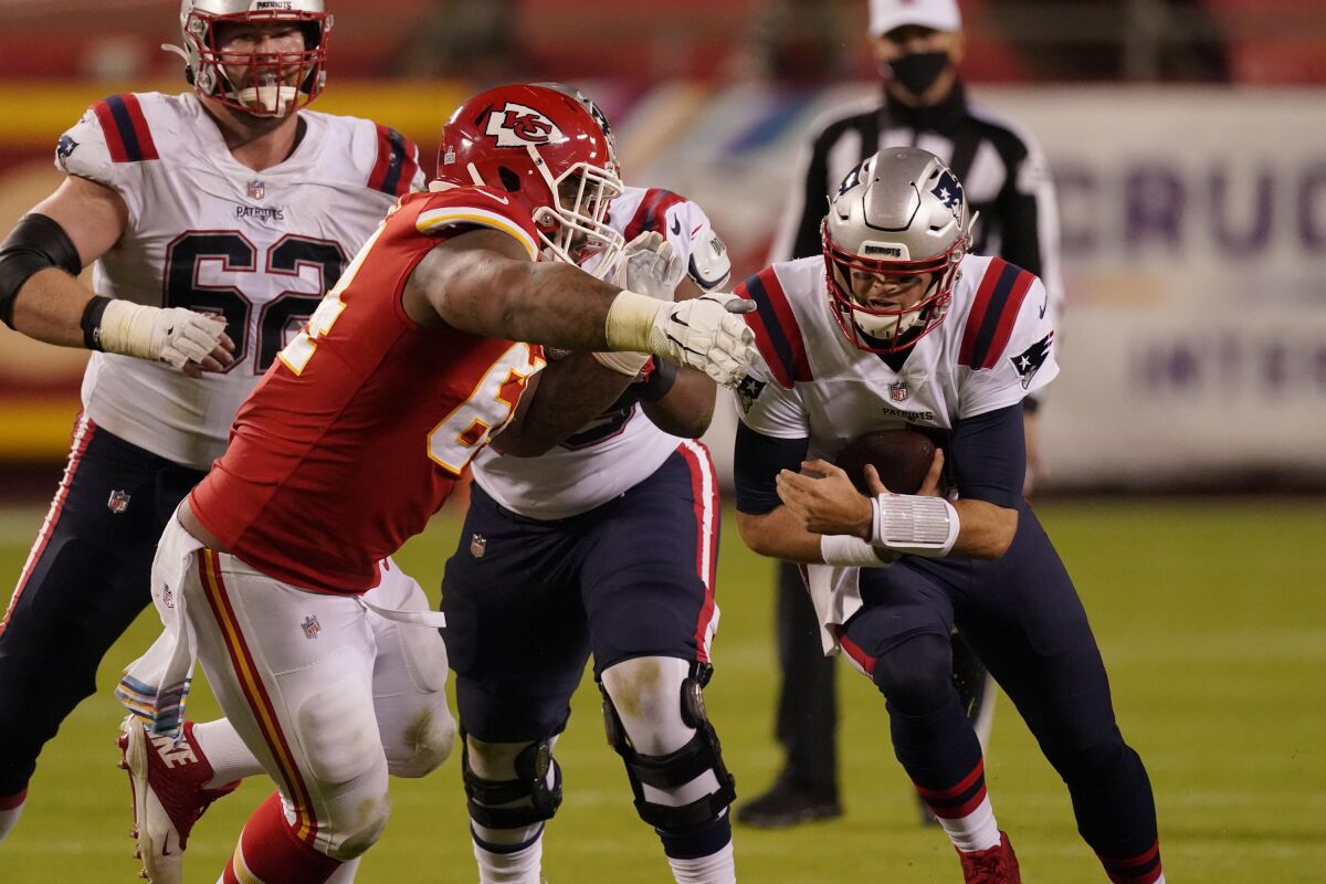 New England Patriots quarterback Jarrett Stidham runs the ball against the Kansas City Chiefs defense.